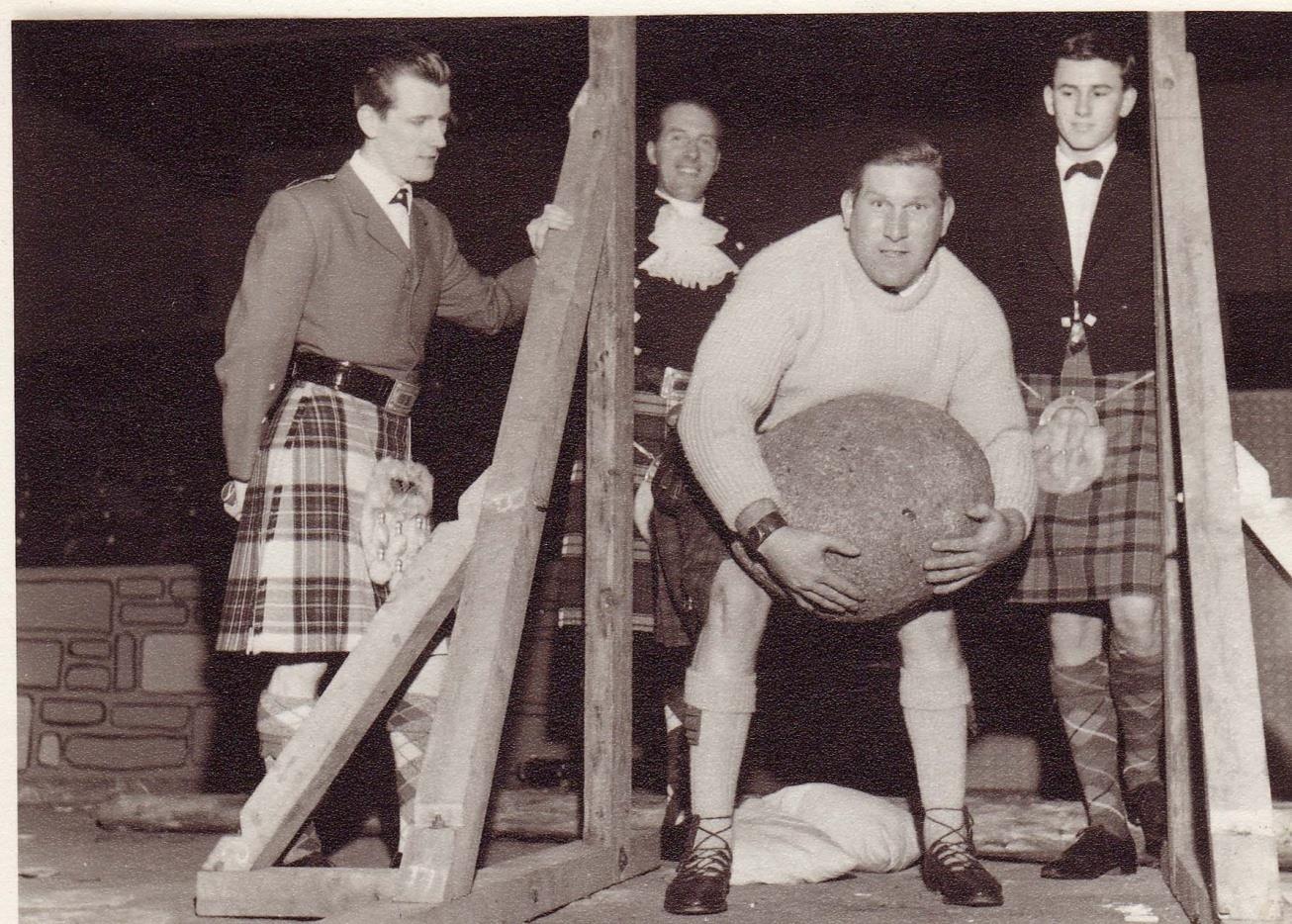 A man lifts the Inver Stone in a competition in Glasgow