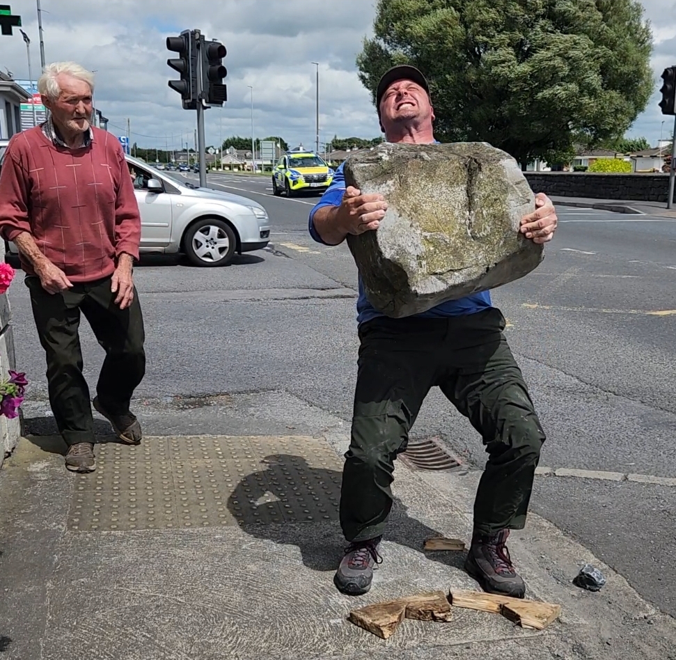 Sean lifts the Claregalway stone