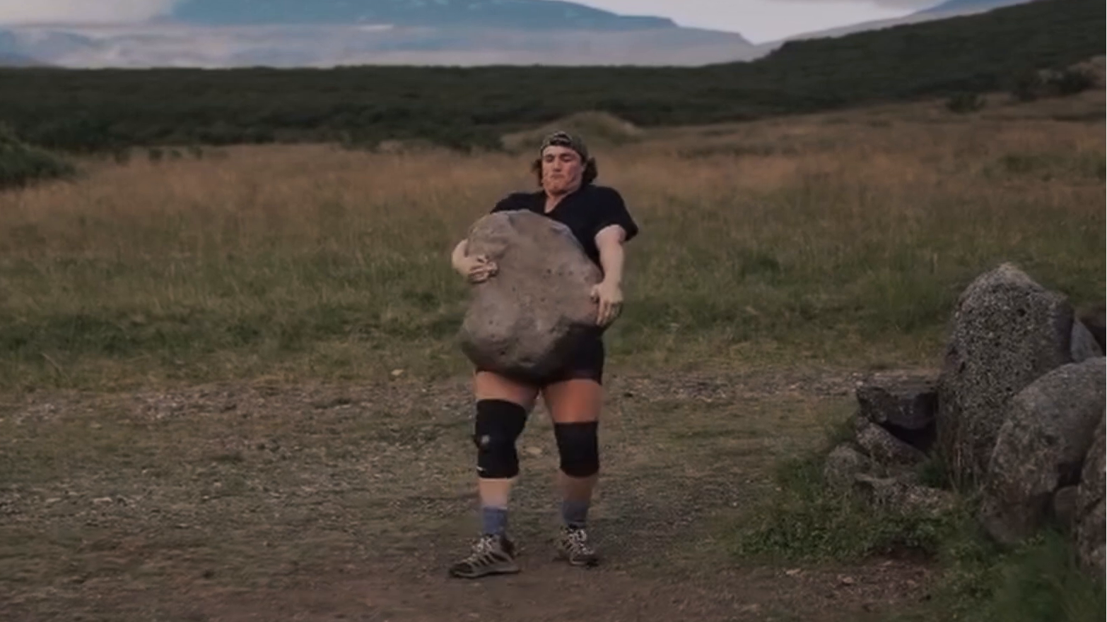 Hannah Linzay carries the Húsafell Stone.