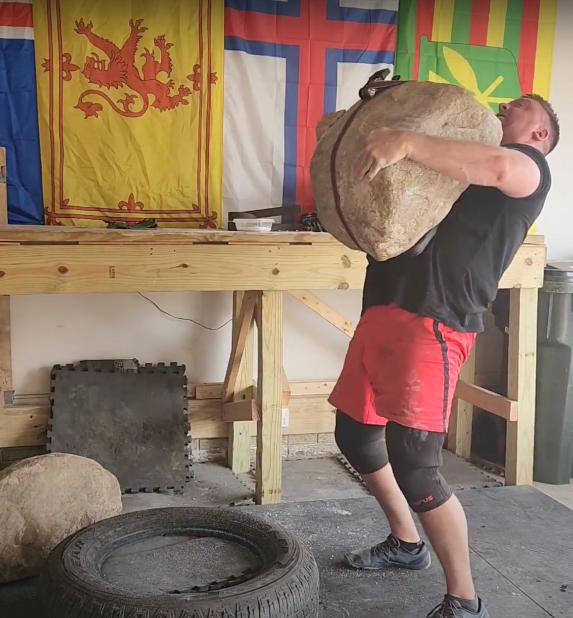 Sean lifts a 440lbs stone in training