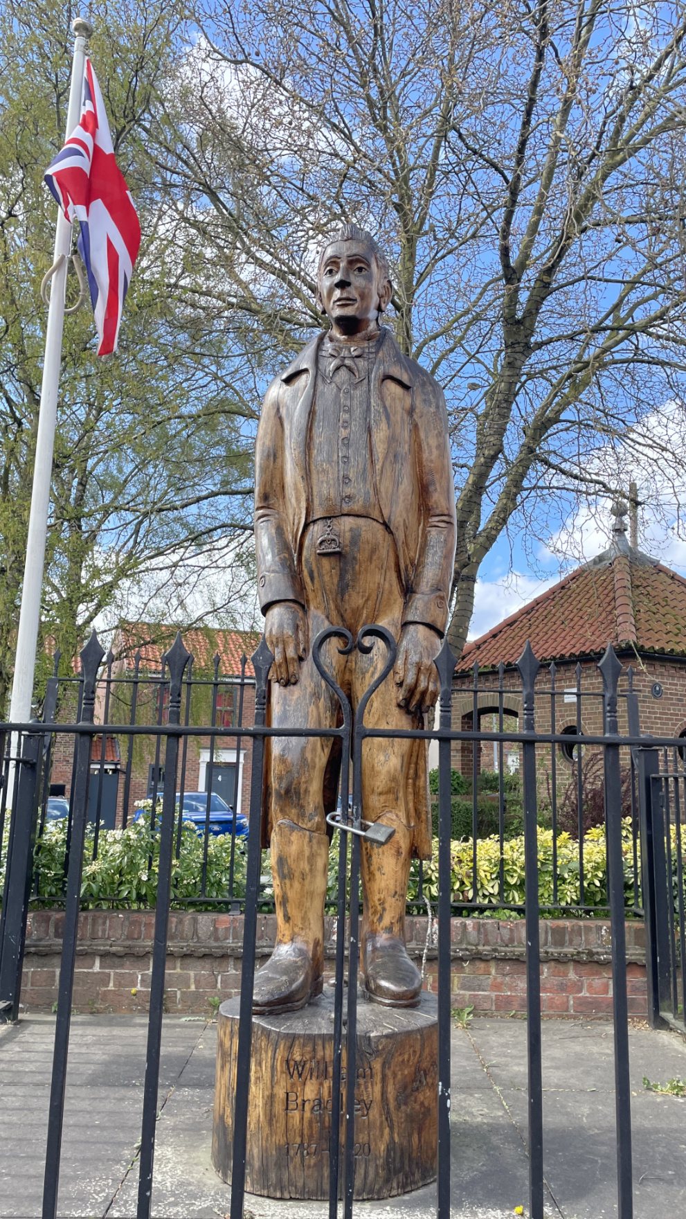 A statue of William Bradley in the middle of Market Weighton carved from oak.